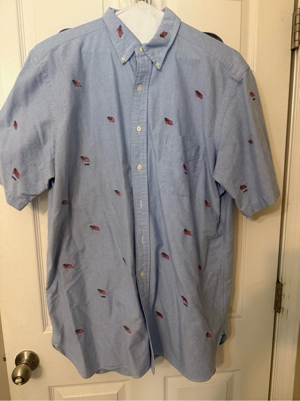 Men's Ralph Lauren Light Blue Button-Down Shirt with Red Embroidered flags.